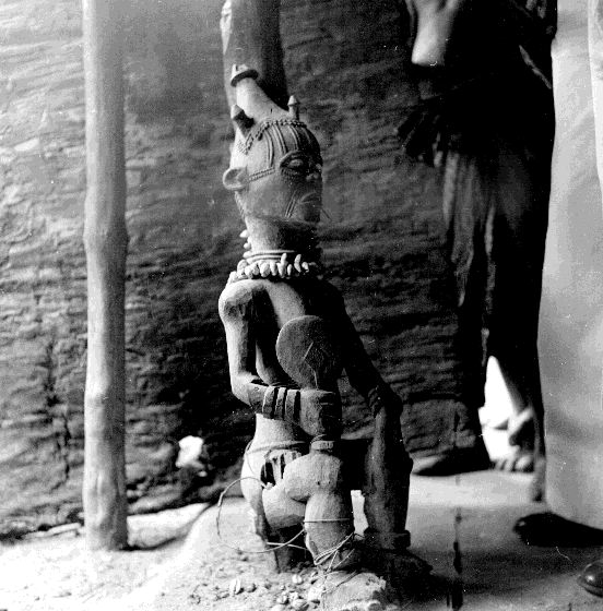 Figure in an ancestral shrine